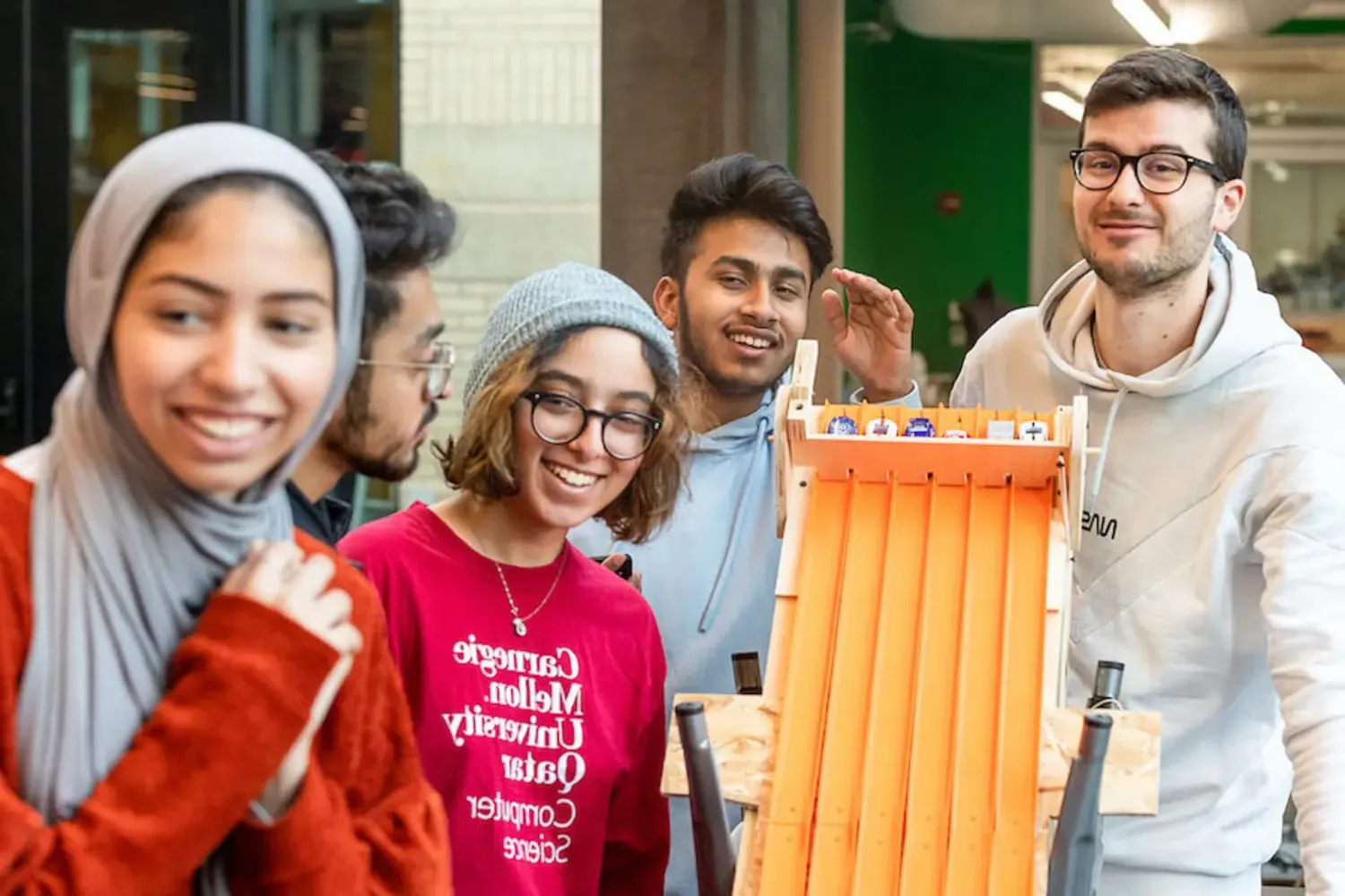 Students participating in CMU's IMPAQT program use a maker space on campus